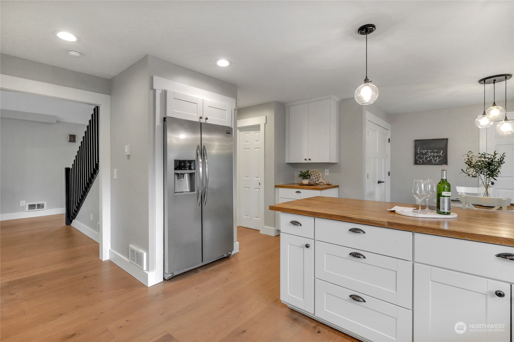 25323 Cromwell Road Monroe, WA 98272 - Photo 13 of 38 a kitchen with white cabinets and stainless steel appliances