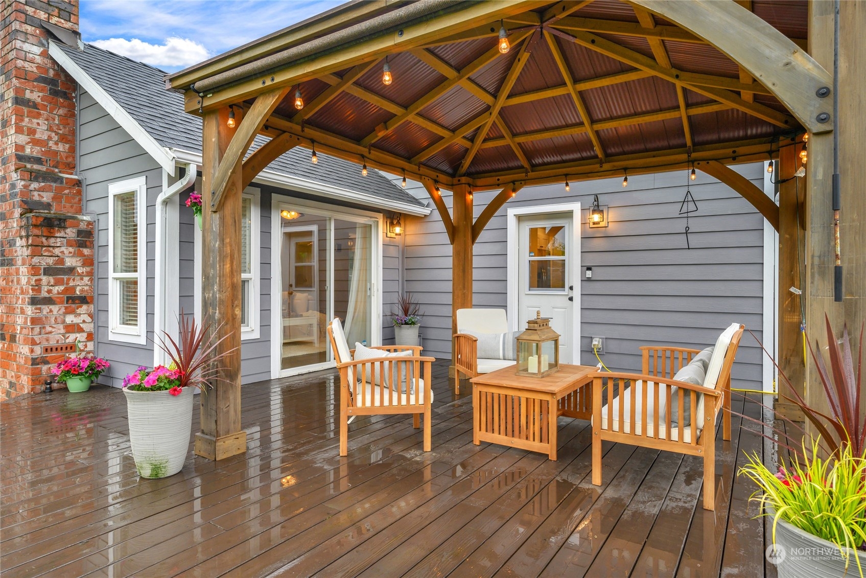 25323 Cromwell Road Monroe, WA 98272 - Photo 24 of 38 a roof deck with table and chairs and potted plants