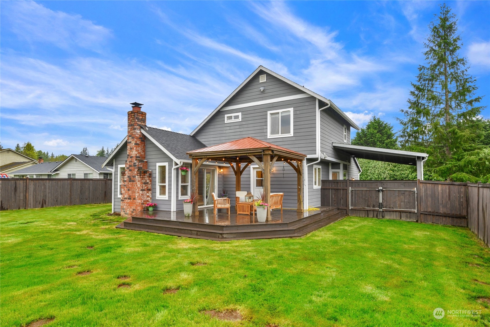 25323 Cromwell Road Monroe, WA 98272 - Photo 25 of 38 a front view of a house with a yard table and chairs