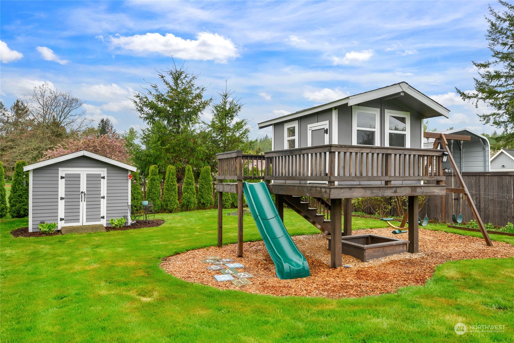 25323 Cromwell Road Monroe, WA 98272 - Photo 28 of 38 a view of a house with a yard