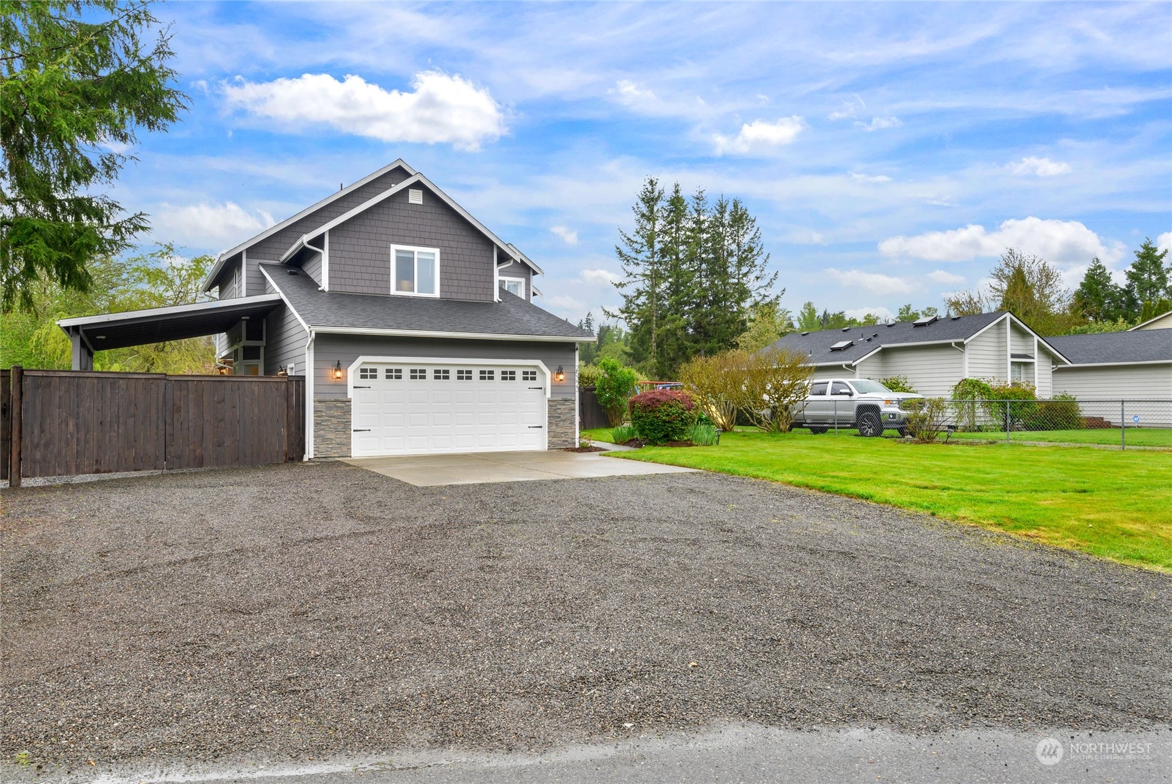 25323 Cromwell Road Monroe, WA 98272 - Photo 30 of 38 a view of a house with a yard and large tree