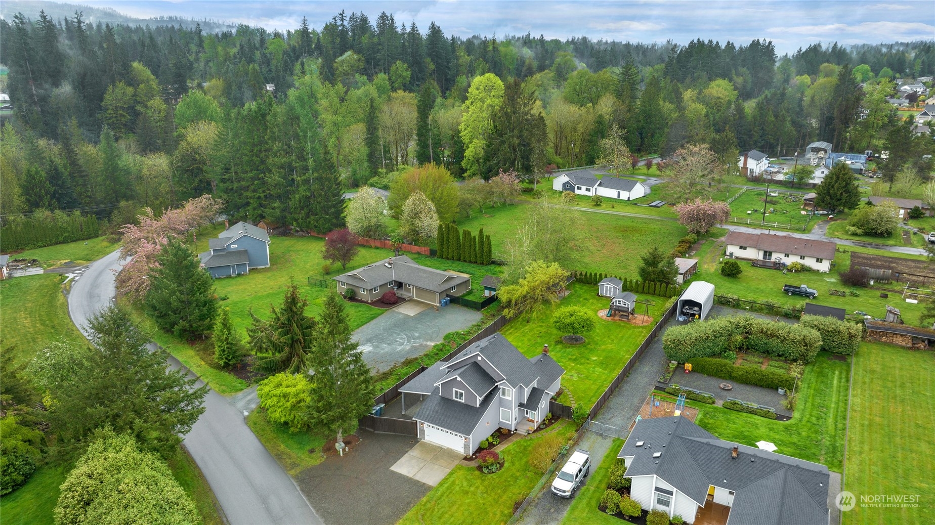 25323 Cromwell Road Monroe, WA 98272 - Photo 33 of 38 a view of a city with lush green forest