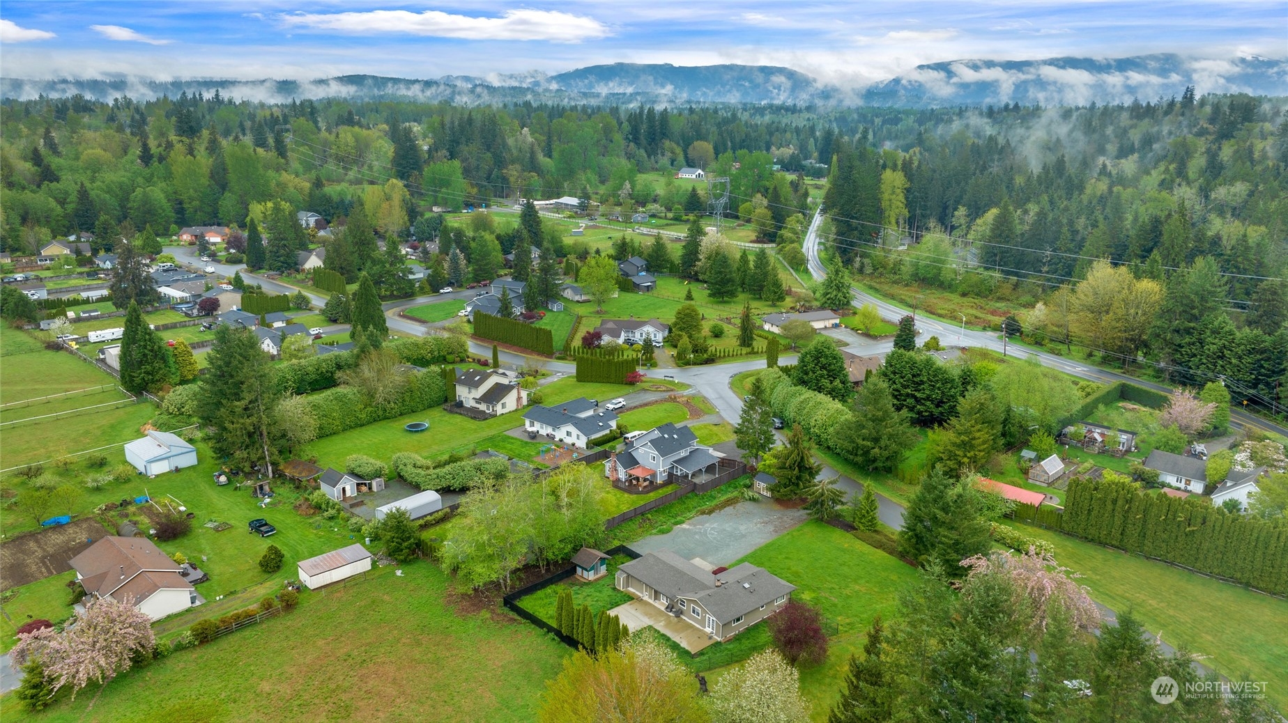 25323 Cromwell Road Monroe, WA 98272 - Photo 36 of 38 a view of a city with lush green forest