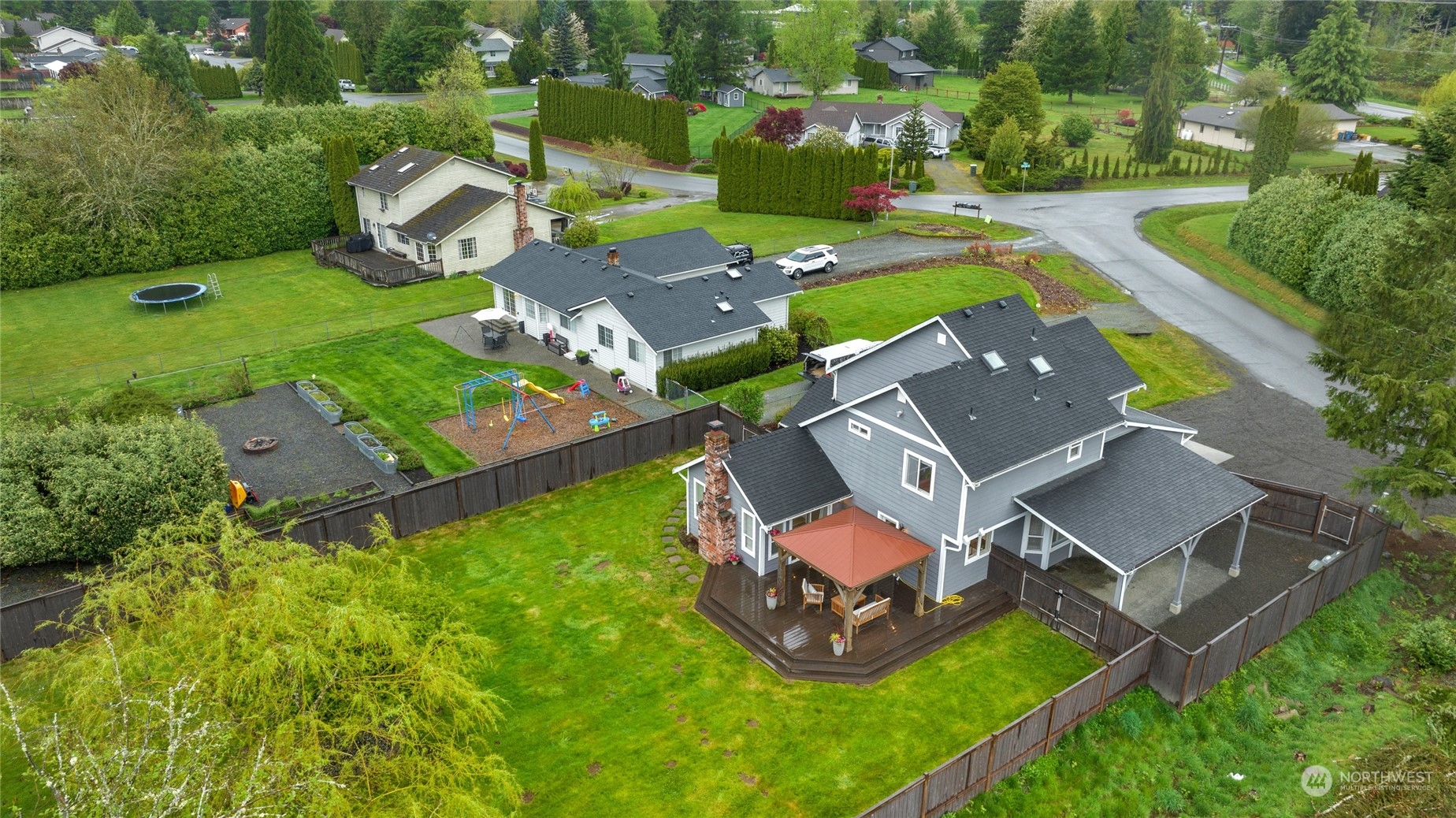 25323 Cromwell Road Monroe, WA 98272 - Photo 38 of 38 an aerial view of a house with garden space and street view