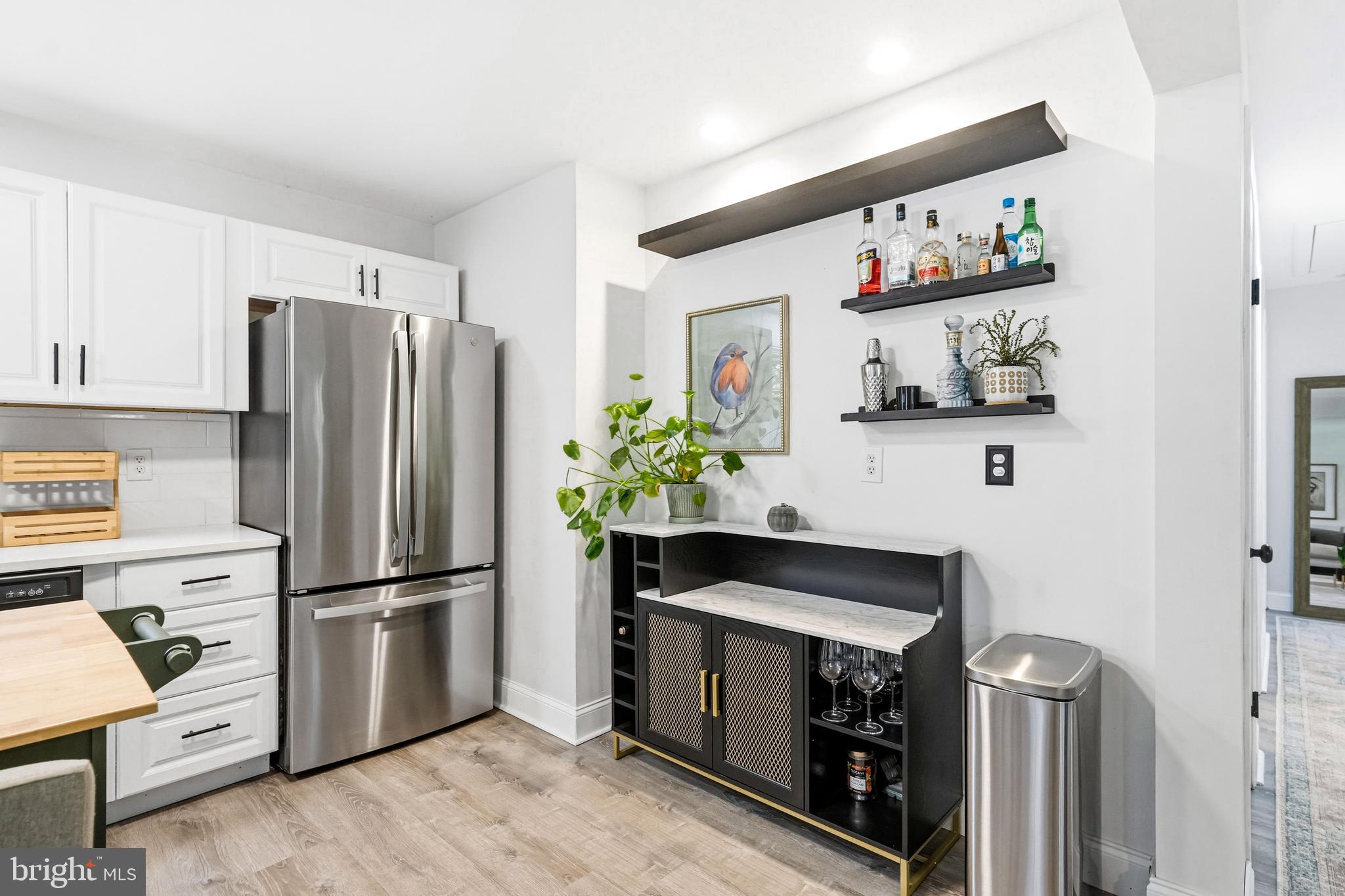 209 Myrtle Lane Berlin, NJ 08009 - Photo 13 of 36 a kitchen with appliances cabinets and wooden floor