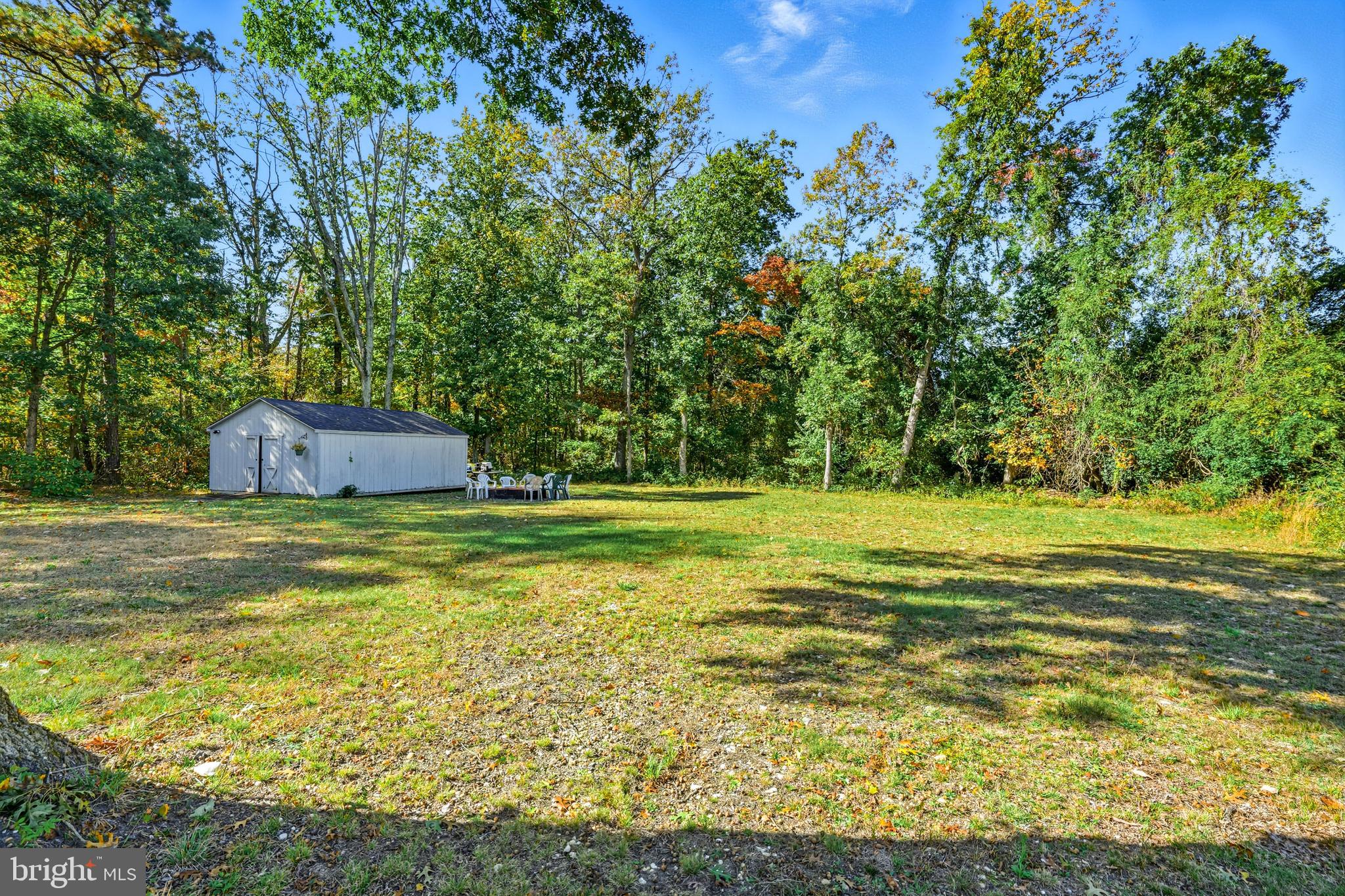 209 Myrtle Lane Berlin, NJ 08009 - Photo 27 of 36 a view of a swimming pool and trees in the background