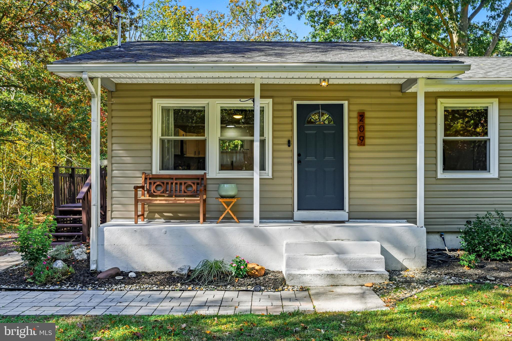 209 Myrtle Lane Berlin, NJ 08009 - Photo 3 of 36 a front view of a house with plants