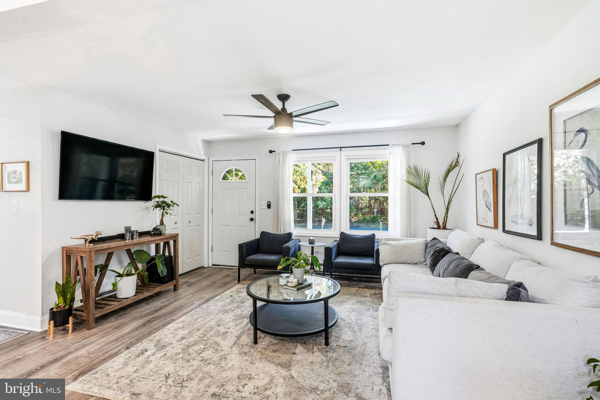 209 Myrtle Lane Berlin, NJ 08009 - Photo 5 of 36 a living room with furniture and a flat screen tv