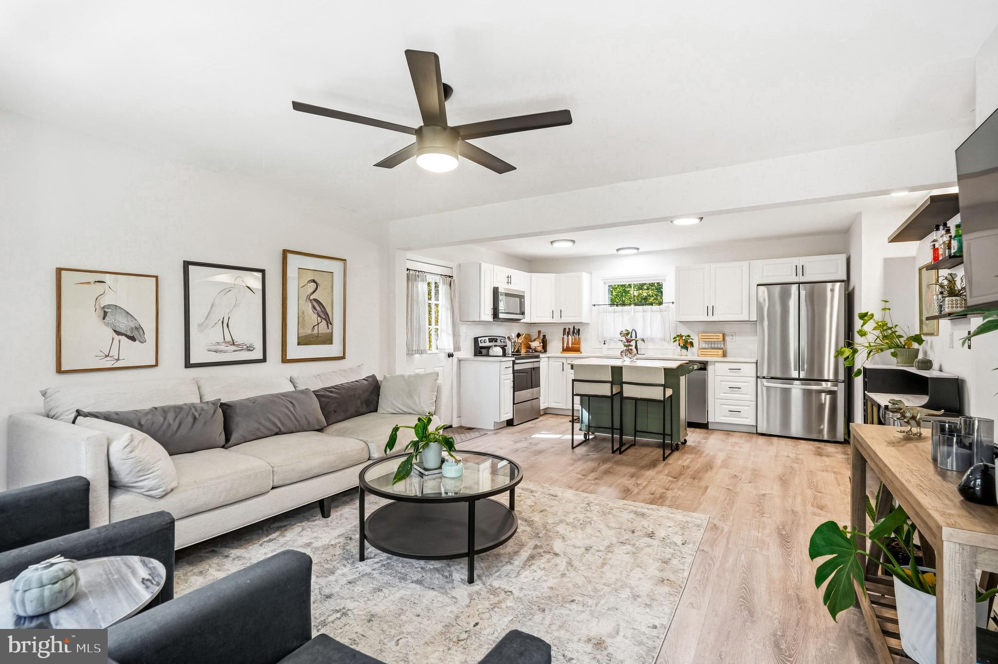 209 Myrtle Lane Berlin, NJ 08009 - Photo 6 of 36 a living room with furniture kitchen view and a potted plant