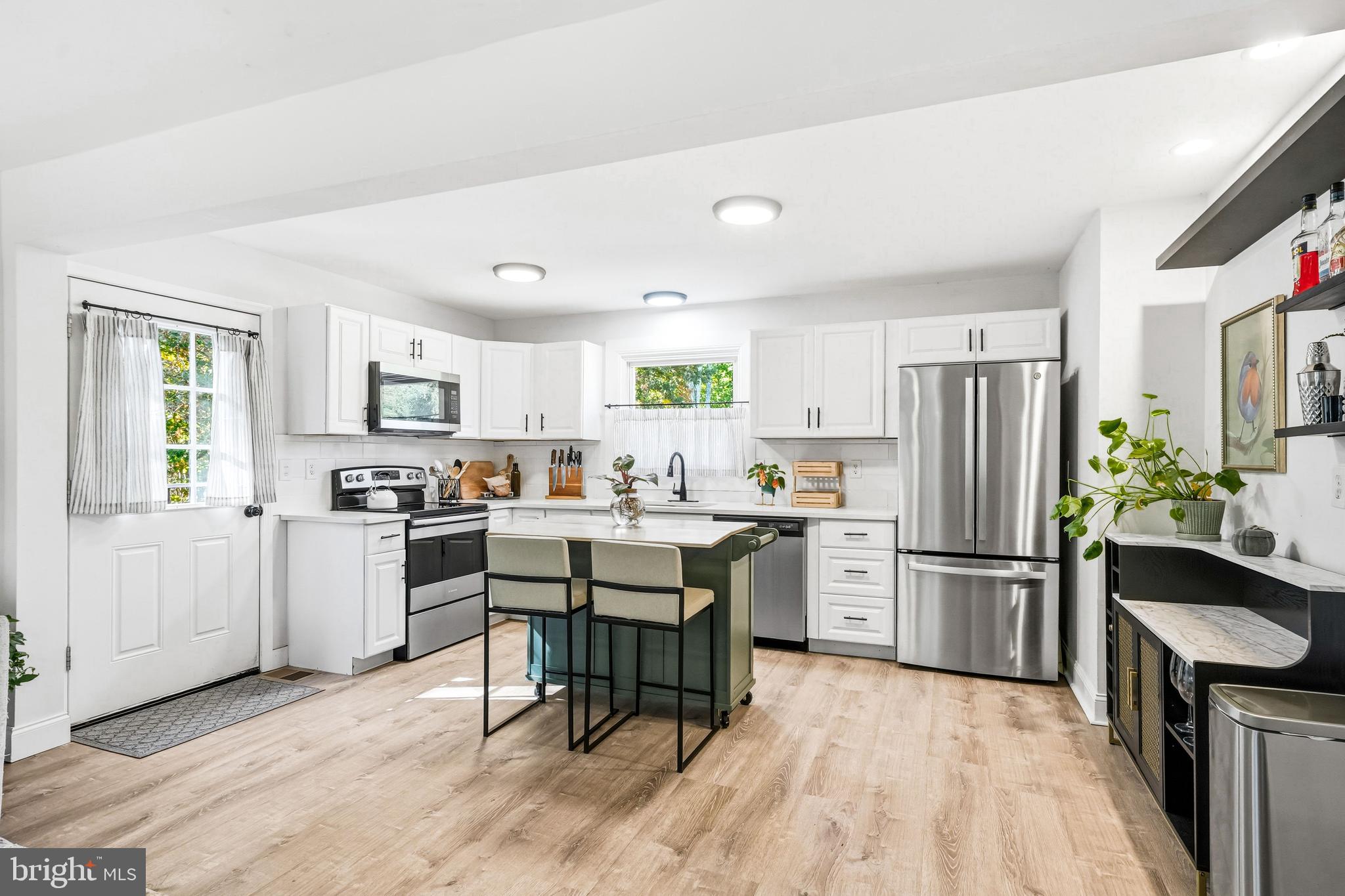 209 Myrtle Lane Berlin, NJ 08009 - Photo 10 of 36 a kitchen with white cabinets and stainless steel appliances