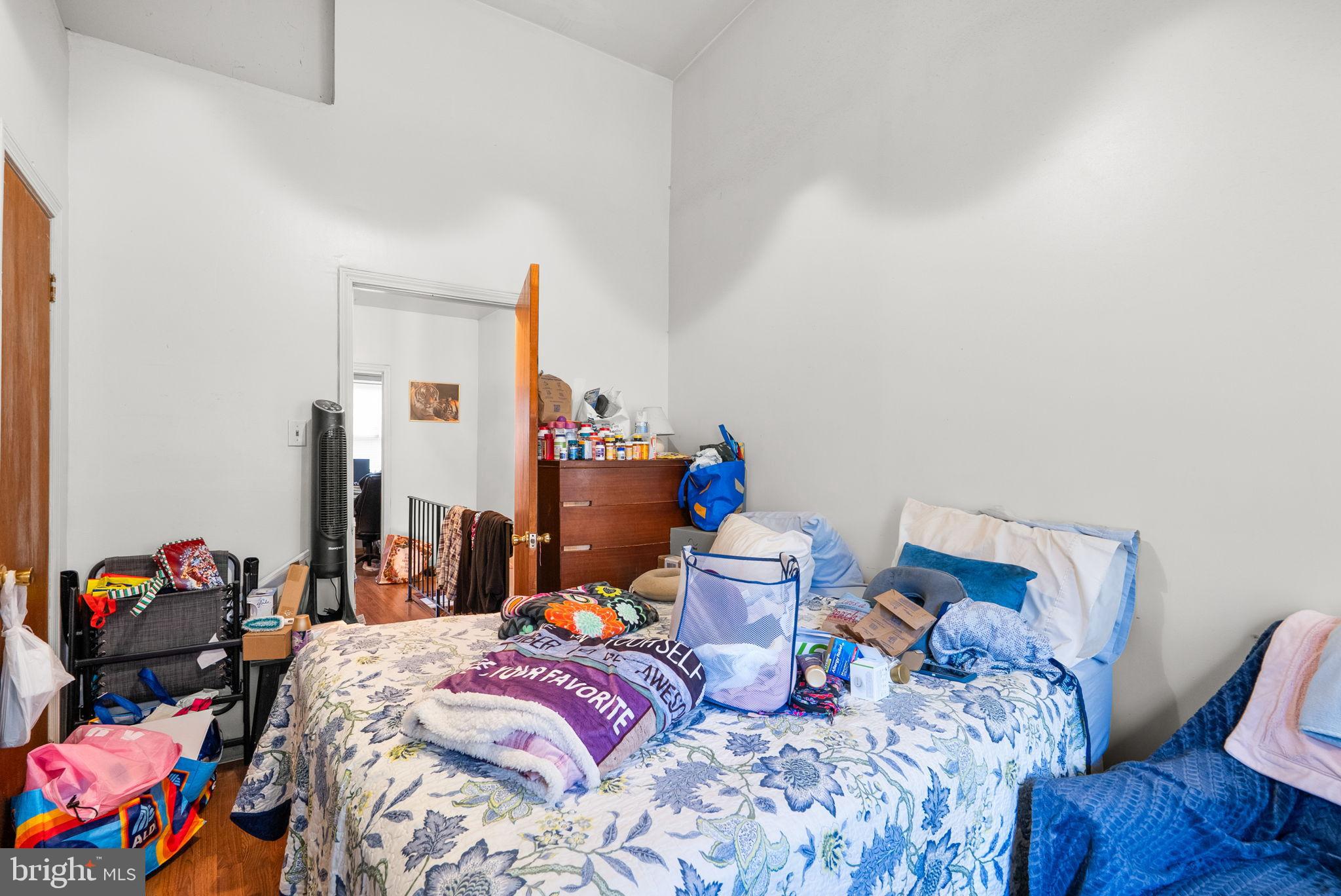 1934 11th Street Northwest Washington, DC 20001 - Photo 11 of 23 a bed room with a bed and a chair