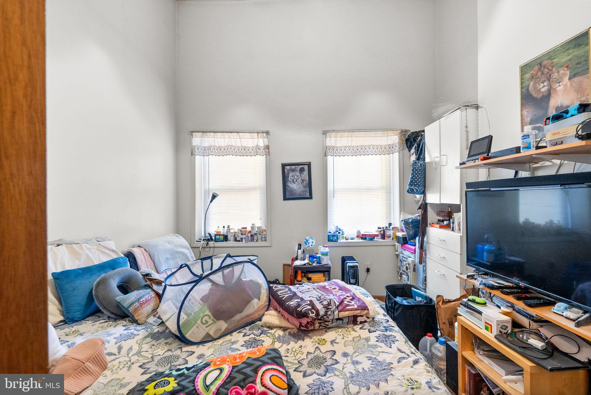 1934 11th Street Northwest Washington, DC 20001 - Photo 10 of 23 a bedroom with furniture and a flat screen tv