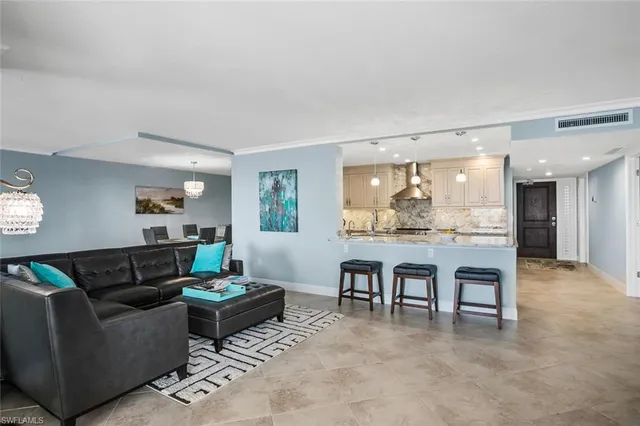 a living room with furniture and a table