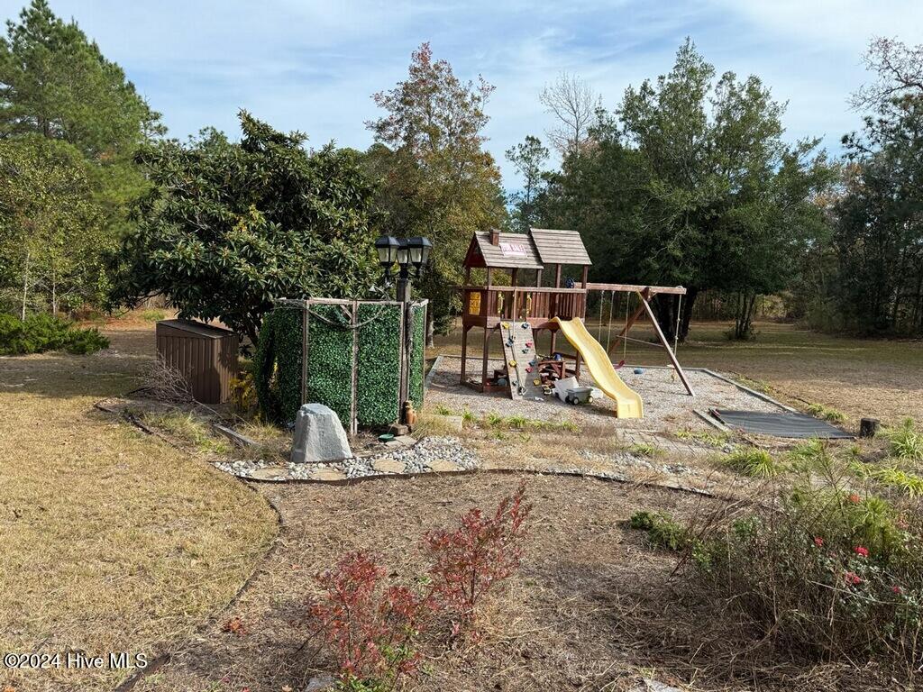 493 Highway 172 Hubert, NC 28539 - Photo 31 of 33 Playground & Outdoor Shower & Well House