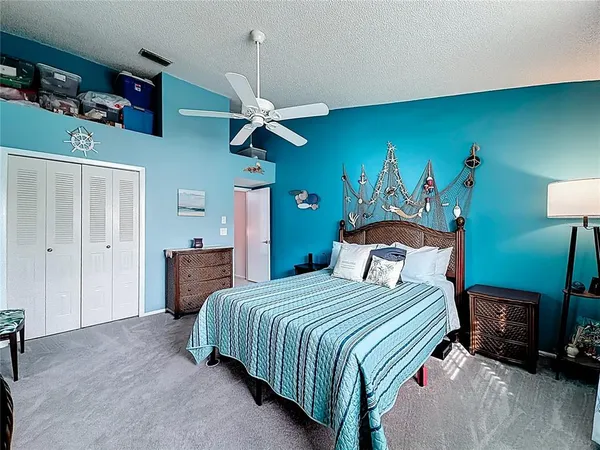 a view of a room with shelves on the wall