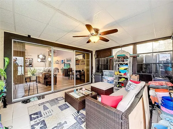 a view of a yard with wooden fence
