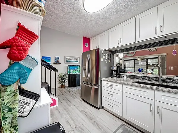 a utility room with dryer washer and other items