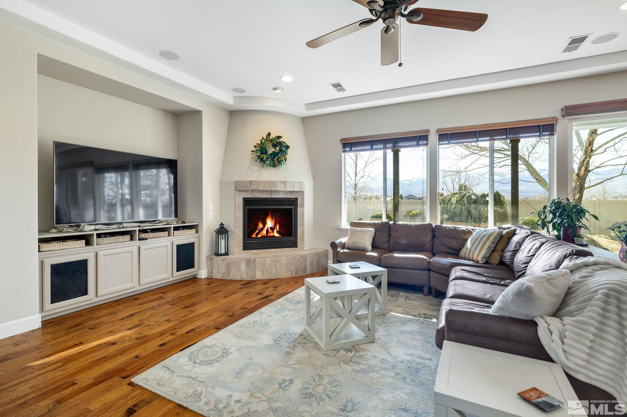 10135 Burghley Lane Reno, NV 89521 - Photo 5 of 39 a living room with furniture and a fireplace