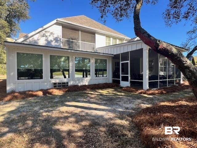 404 Peninsula Boulevard Gulf Shores, AL 36542 - Photo 43 of 51 Back of property featuring a sunroom