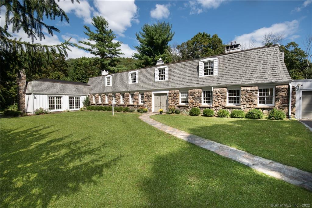78 Sherwood Road Ridgefield, CT 06877 - Photo 1 of 1 a front view of a house with a yard