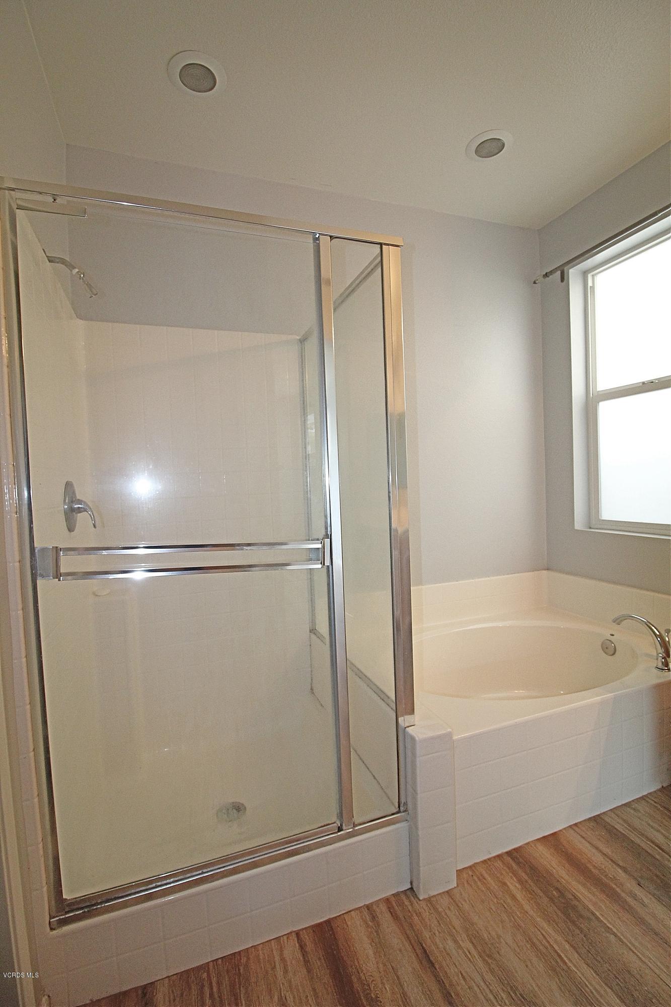 351 Huerta Street Oxnard, CA 93030 - Photo 15 of 18 a bathroom with a bathtub and a shower