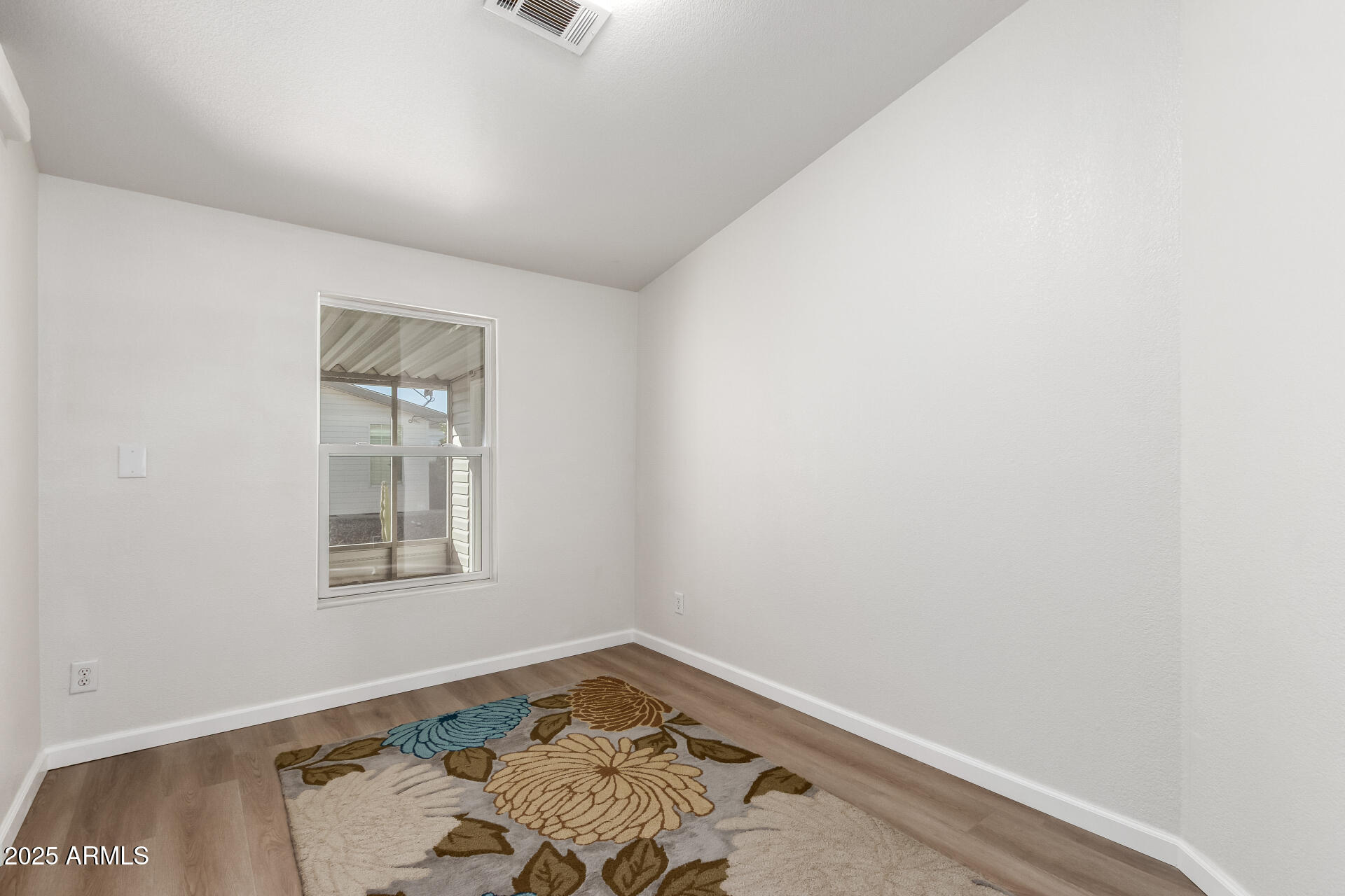3301 South Goldfield Road, Unit 2006 Apache Junction, AZ 85119 - Photo 21 of 40 an empty room with windows