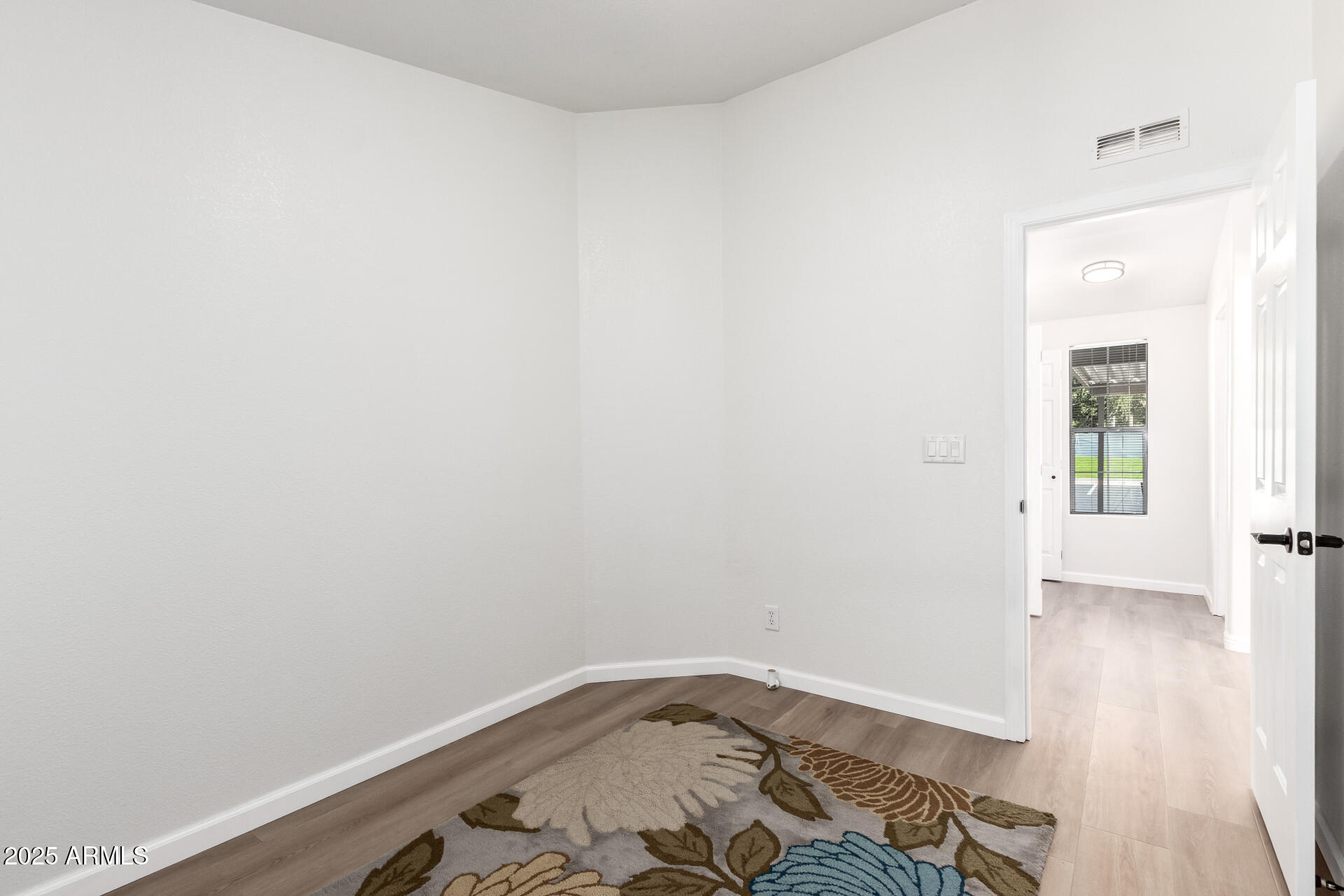 3301 South Goldfield Road, Unit 2006 Apache Junction, AZ 85119 - Photo 24 of 40 a room with a wooden floor and a sink