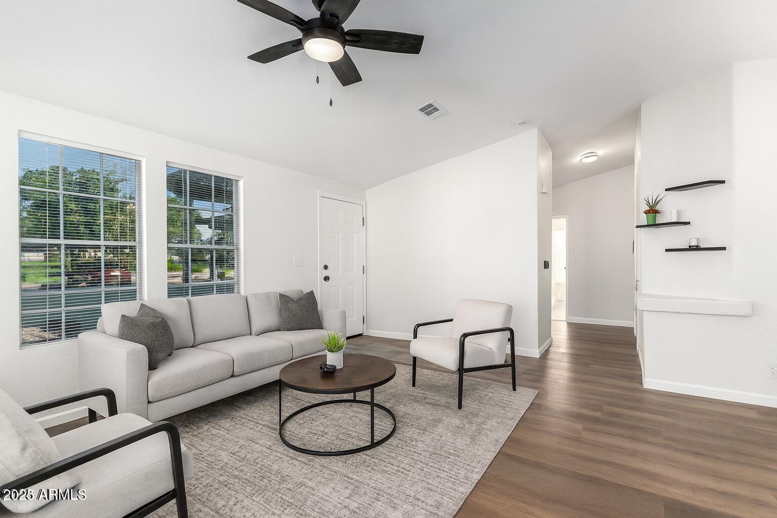 3301 South Goldfield Road, Unit 2006 Apache Junction, AZ 85119 - Photo 3 of 40 a living room with furniture and a table