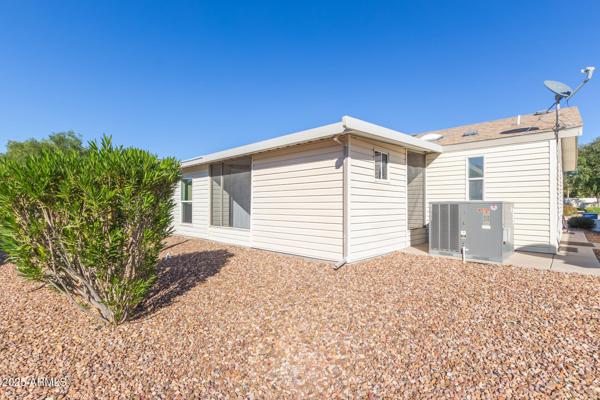 3301 South Goldfield Road, Unit 2006 Apache Junction, AZ 85119 - Photo 31 of 40 a front view of a house with a yard