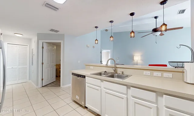 a view of a hallway with washer and dryer