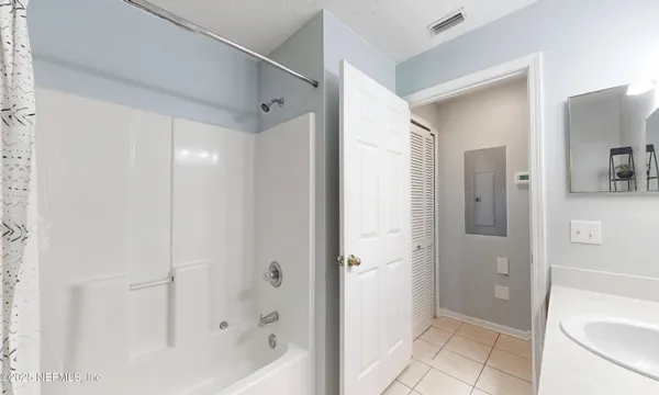a view of a balcony with wooden floor