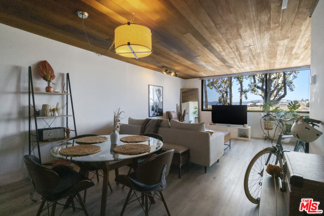 6209 Pacific Avenue, Unit 103 Playa del Rey, CA 90293 - Photo 32 of 40 a view of a dining room with furniture and wooden floor