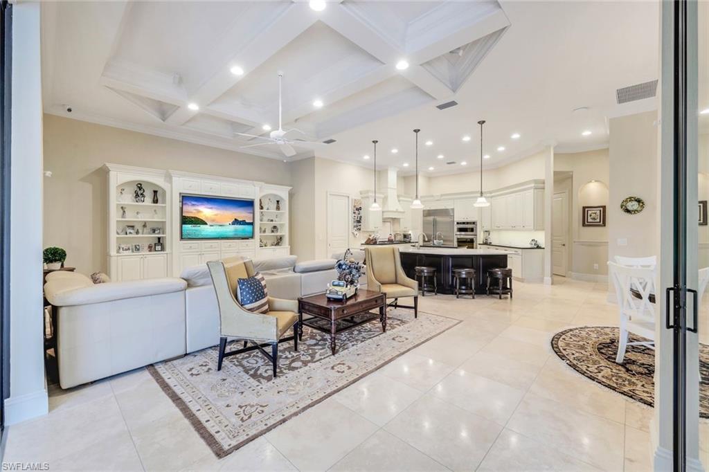 9243 Marble Stone Drive Naples, FL 34120 - Photo 19 of 50 a living room with furniture and a table