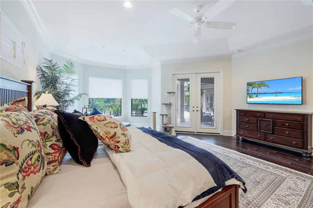 9243 Marble Stone Drive Naples, FL 34120 - Photo 26 of 50 a bed room with a bed and a dresser