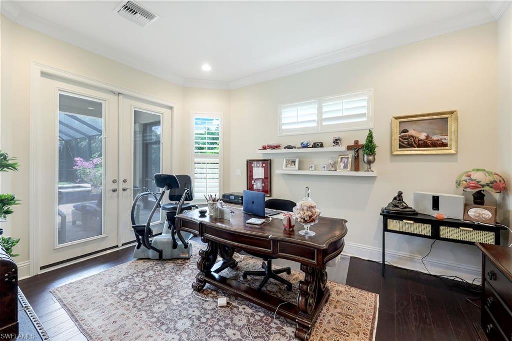 9243 Marble Stone Drive Naples, FL 34120 - Photo 31 of 50 a living room with furniture and wooden floor