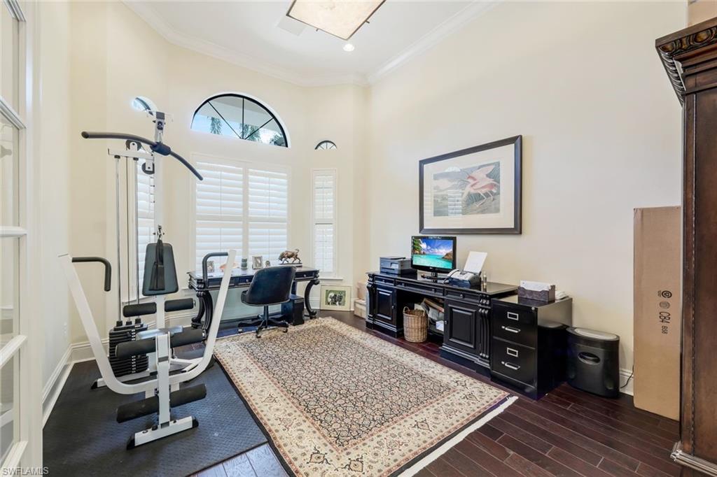 9243 Marble Stone Drive Naples, FL 34120 - Photo 33 of 50 a living room with furniture a rug and a large window