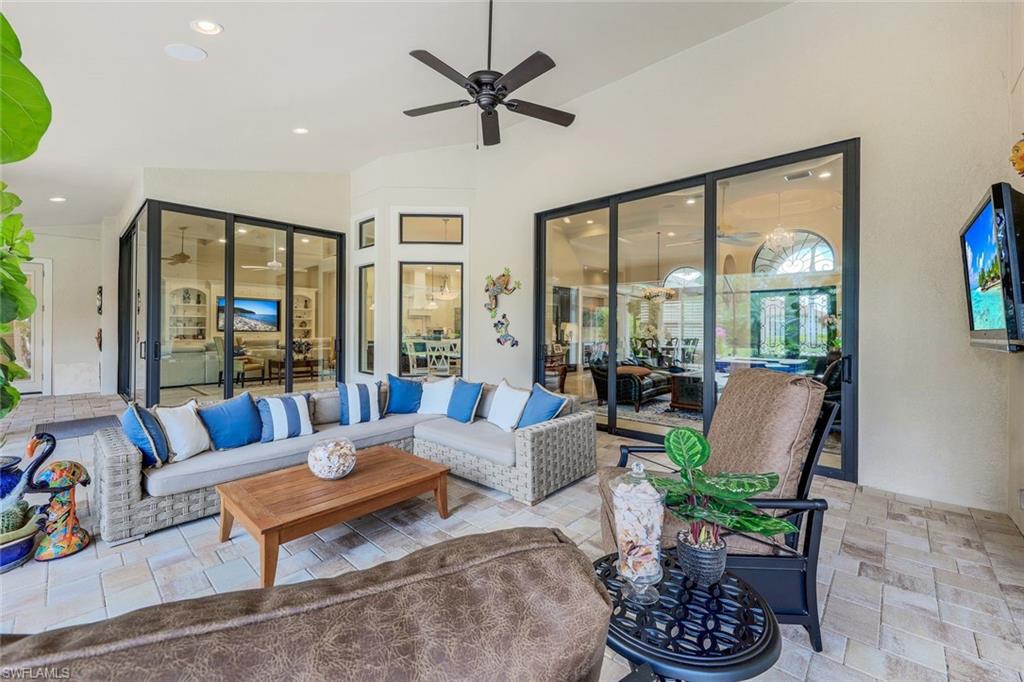 9243 Marble Stone Drive Naples, FL 34120 - Photo 36 of 50 a living room with furniture and a large window