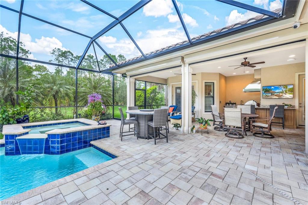 9243 Marble Stone Drive Naples, FL 34120 - Photo 43 of 50 a outdoor space with lots of furniture and garden