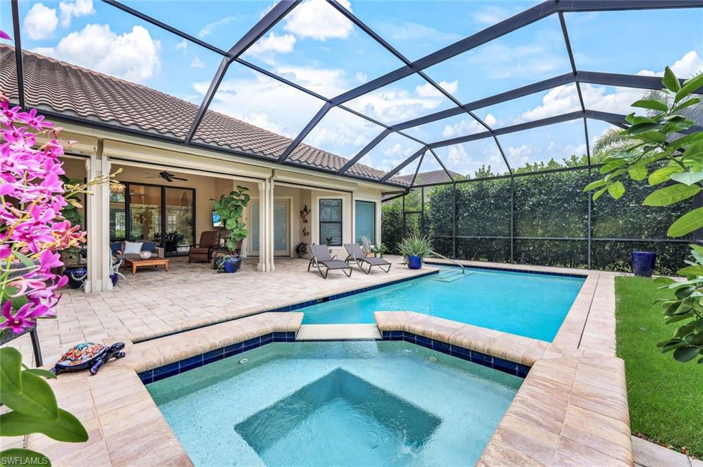 9243 Marble Stone Drive Naples, FL 34120 - Photo 47 of 50 a room with pool table and sofas