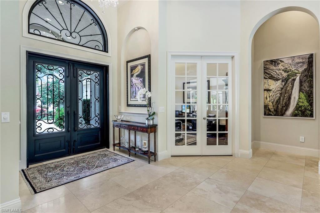 9243 Marble Stone Drive Naples, FL 34120 - Photo 6 of 50 a view of front door with a couch