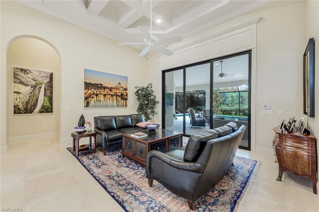 9243 Marble Stone Drive Naples, FL 34120 - Photo 7 of 50 a living room with furniture and a large window