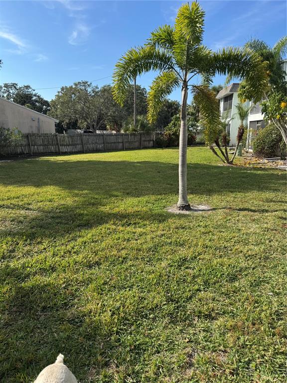 391 South McMullen Booth Road, Unit 7 Clearwater, FL 33759 - Photo 5 of 16 a swimming pool with an outdoor space and seating area