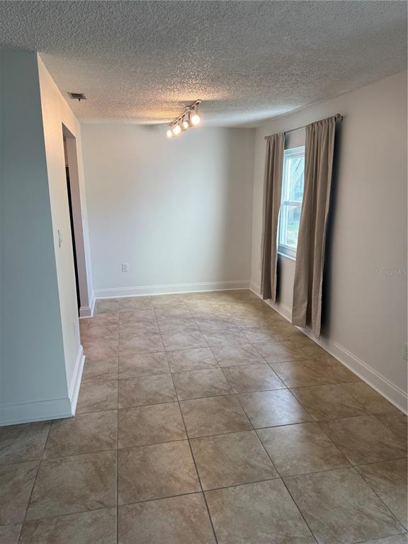 391 South McMullen Booth Road, Unit 7 Clearwater, FL 33759 - Photo 9 of 16 a view of an empty room with a mirror