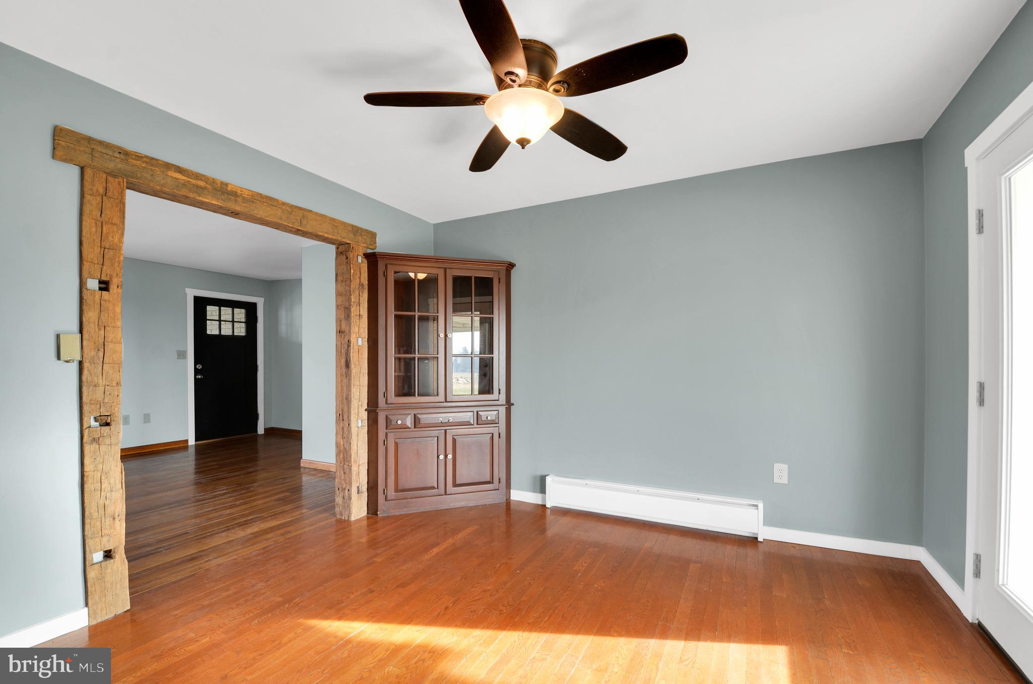 221 Hartman Road Reading, PA 19606 - Photo 12 of 29 wooden floor in an empty room and a window