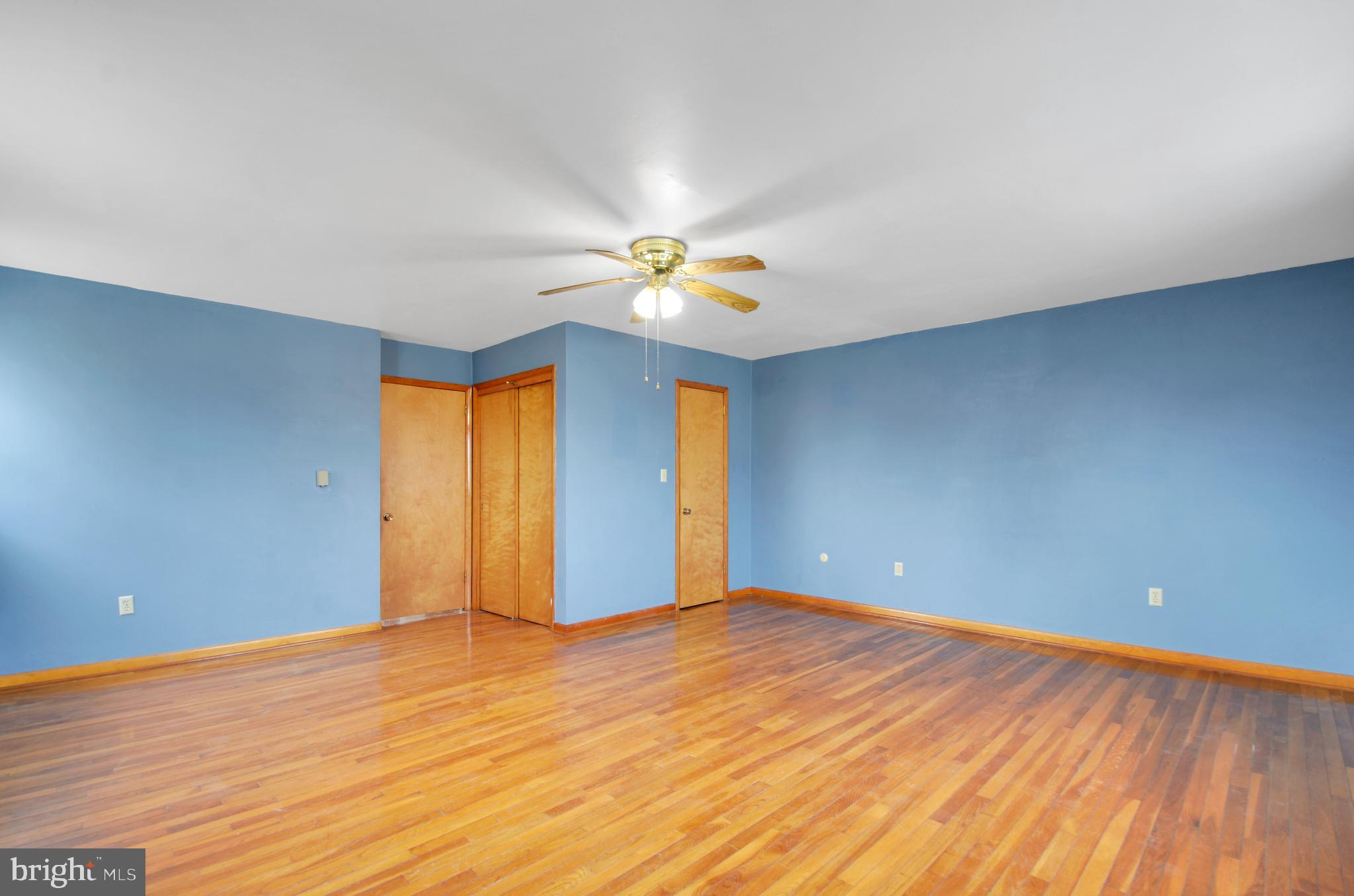 221 Hartman Road Reading, PA 19606 - Photo 18 of 29 a view of an empty room with window and wooden floor
