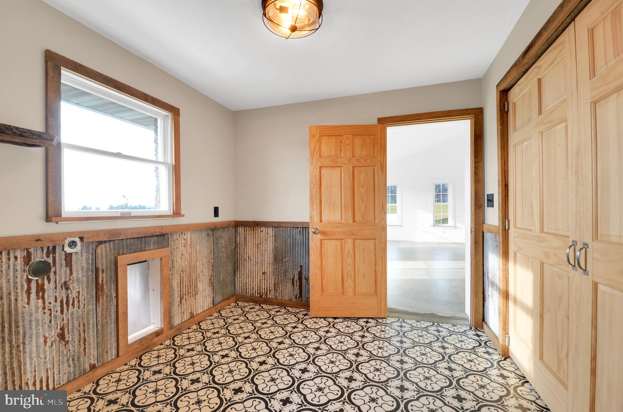 221 Hartman Road Reading, PA 19606 - Photo 21 of 29 a view of a hallway with wooden floor and a cabinet