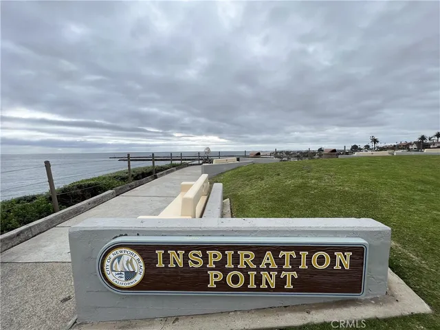 a view of a street sign under a large building