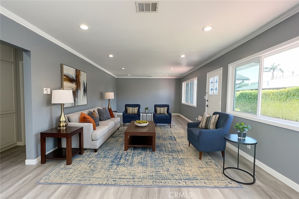 457 Seaward Road, Unit B Newport Beach, CA 92625 - Photo 3 of 16 a living room with furniture and a large window