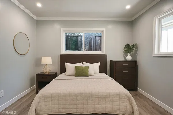 a bedroom with a bed and window