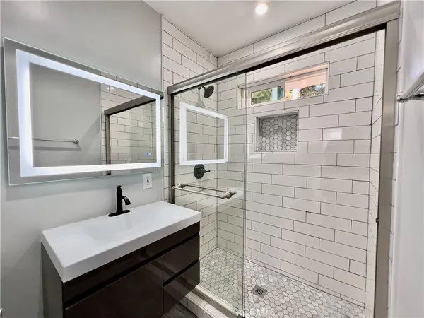 a bathroom with a sink and a mirror